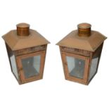 A pair of copper candle wall lanterns