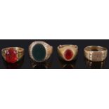 An 18ct gold gentleman's gem set ring together with four other rings