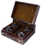 A collection of early 20th Century Thomas Taylor of Glasgow lignum vitae lawn bowls