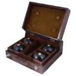 A collection of early 20th Century Thomas Taylor of Glasgow lignum vitae lawn bowls