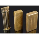 Three gold plated cigarette lighters