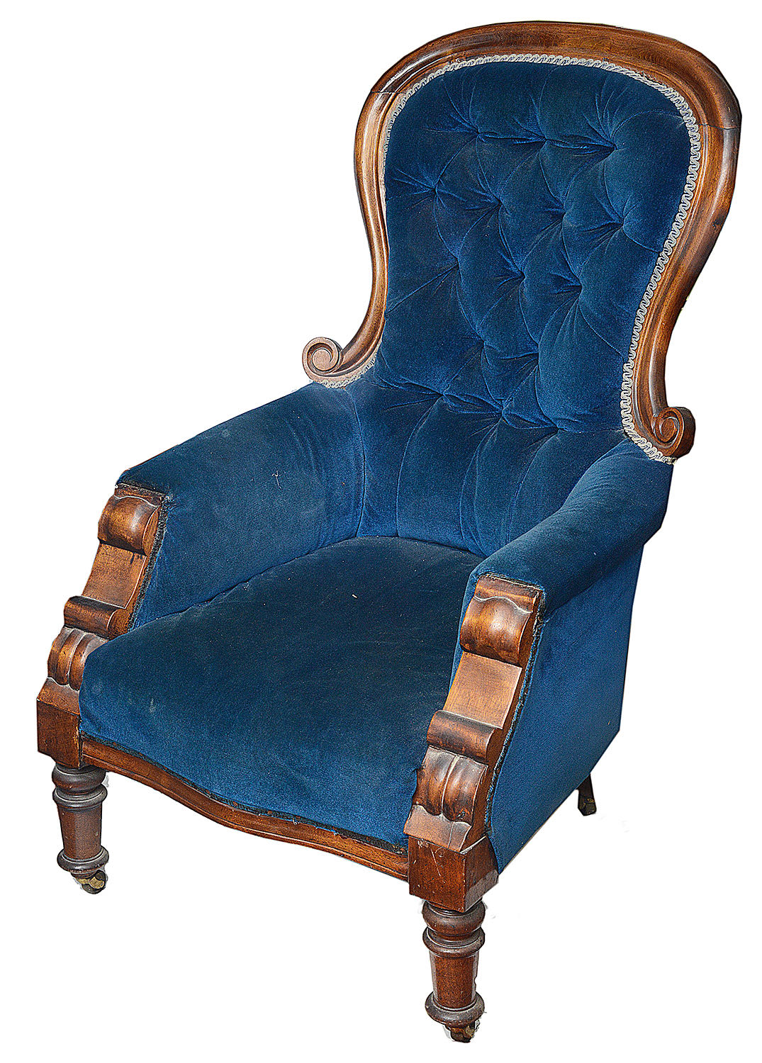 An early Victorian mahogany framed button back upholstered armchair