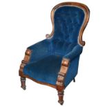 An early Victorian mahogany framed button back upholstered armchair
