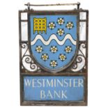 An early 20th century wrought iron and painted blue enamel double sided Westminster Bank sign
