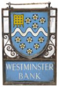 An early 20th century wrought iron and painted blue enamel double sided Westminster Bank sign