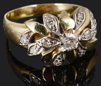 A contemporary diamond set fancy cluster ring of foliate design