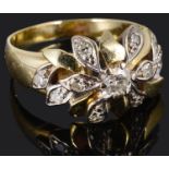 A contemporary diamond set fancy cluster ring of foliate design