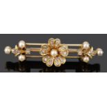 A charming late Victorian/early Edwardian diamond and pearl daisy cluster triple bar brooch