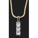 A contemporary Continental three stone diamond set drop pendant