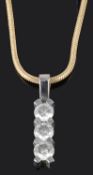 A contemporary Continental three stone diamond set drop pendant