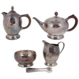 A five piece Liberty & Co. Arts and Crafts silver tea service model 5920