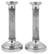 A pair of early 20th century Dutch .833 silver fluted column candlesticks