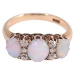 An attractive Edwardian three stone opal and diamond set ring