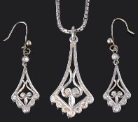 A Continental diamond set scroll pendant with matching earrings