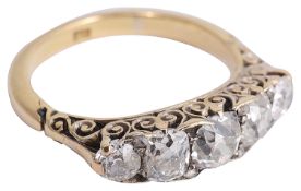 A five stone diamond set half hoop ring