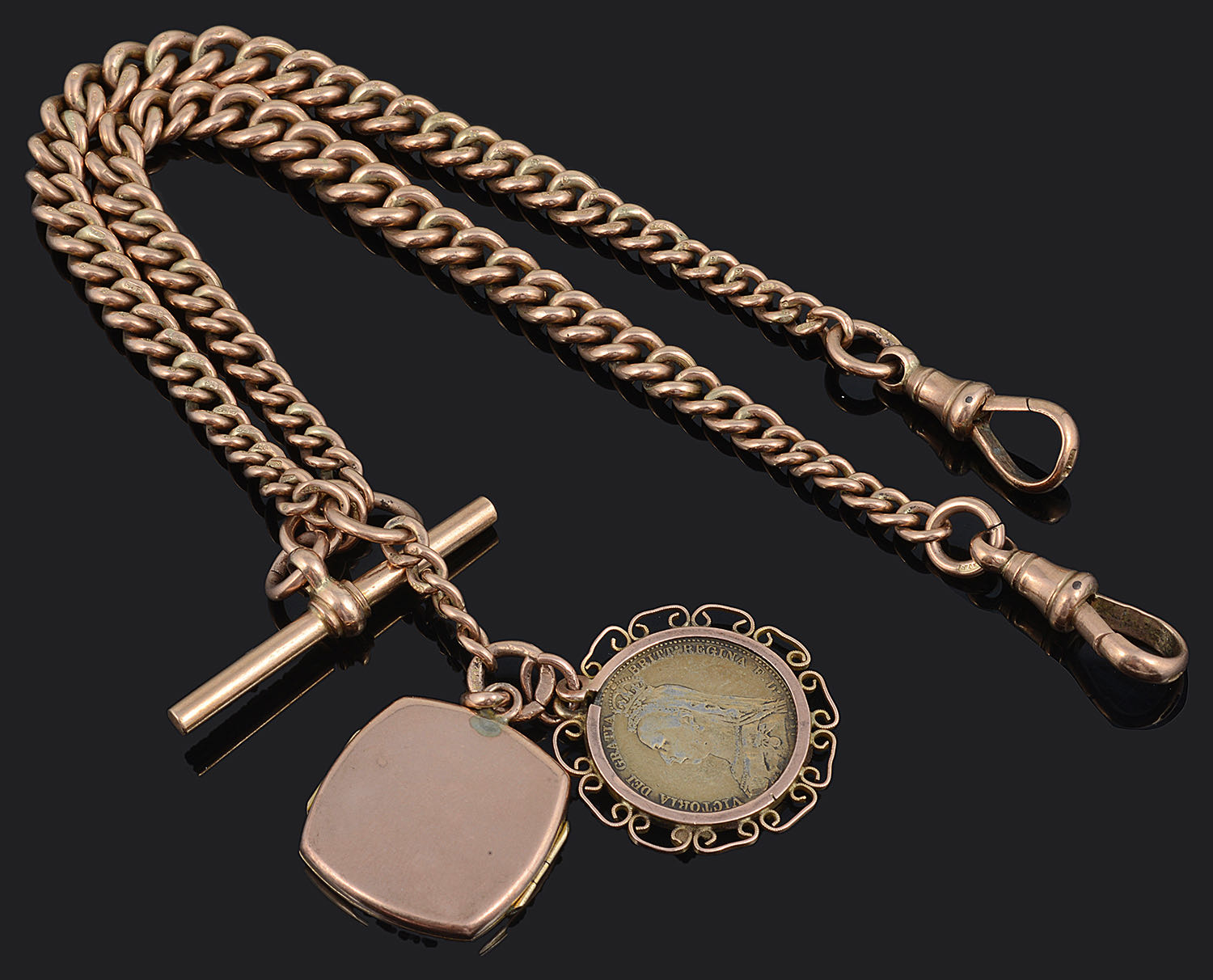 A 9ct rose gold watch Albert chain with Victorian gilt fob