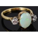 A Continental three stone opal and diamond set ring
