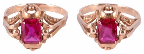 A pair of Continental ruby set dress rings