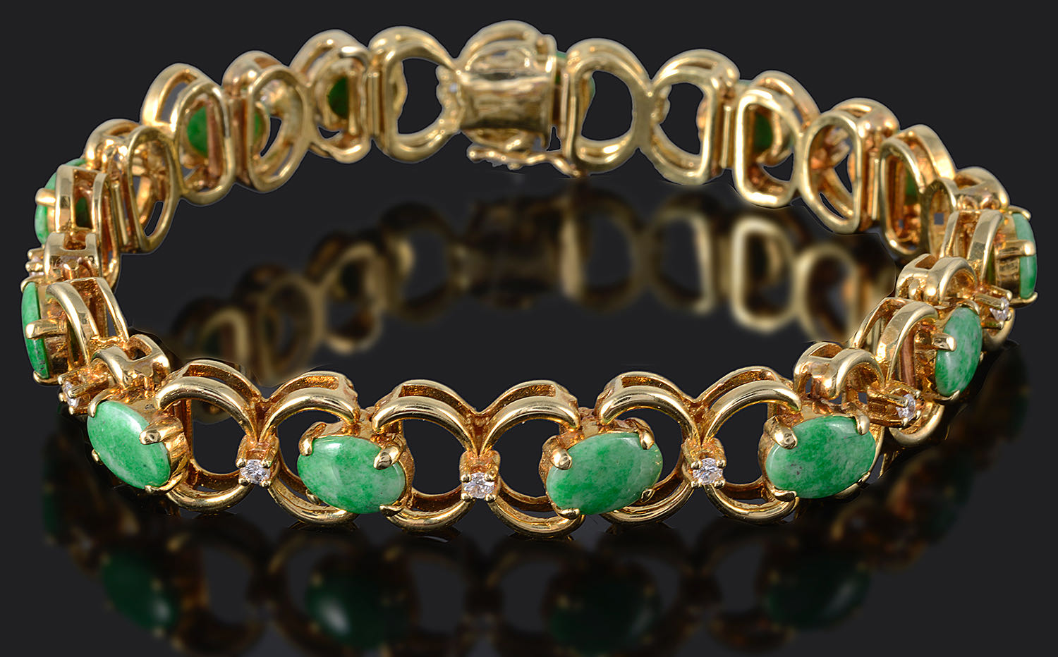 A Continental diamond and jade articulated bracelet