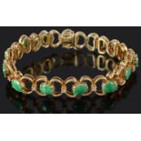 A Continental diamond and jade articulated bracelet