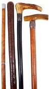 An Edwardian three section gadget walking stick and three other walking sticks