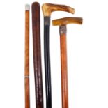 An Edwardian three section gadget walking stick and three other walking sticks