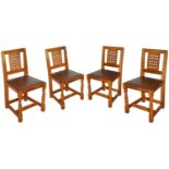 A set of four Robert 'Mouseman' Thompson of Kilburn lattice back dining chairs