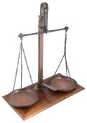 A large set of late 19th century brass and copper balance scales or confectioner's scales