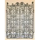 A pair of early 20th century black painted wrought iron garden gates