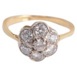 An Edwardian diamond set daisy cluster ring