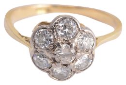 An Edwardian diamond set daisy cluster ring