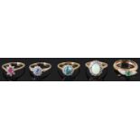 A blue zircon and diamond cluster ring and four other gem set dress rings