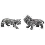 A pair of Edward VII naturalistically cast figures of a standing lion and lioness