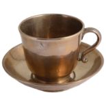 An unusual 19th century large polished bronze tea cup and saucer