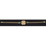 A Continental, contemporary 18ct gold gem set coin bracelet