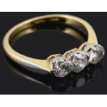 A three stone diamond set ring