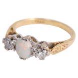 A three stone opal and diamond set ring