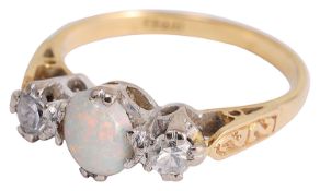 A three stone opal and diamond set ring