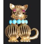 An amusing ruby and turquoise set cat cocktail brooch, circa 1950