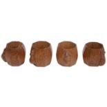 A set of four Robert 'Mouseman' Thompson of Kilburn octagonal oak napkin rings