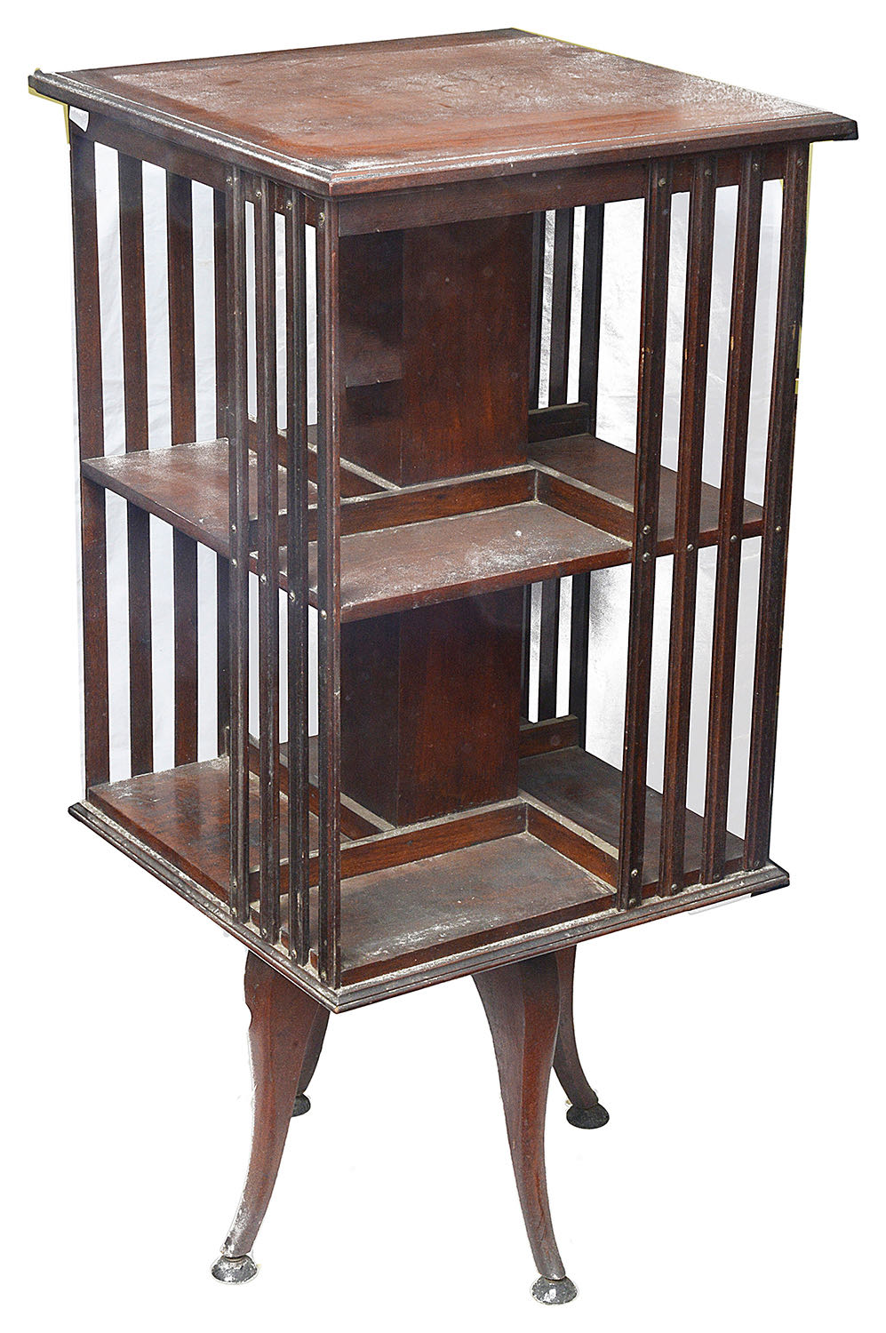 An Edwardian mahogany revolving two tier bookcase