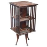 An Edwardian mahogany revolving two tier bookcase