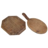 A Robert 'Mouseman' Thompson of Kilburn octagonal oak bread board and oval cheese board with handle