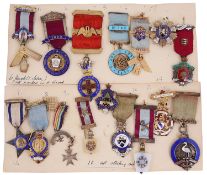 A collection of early 20th c. silver gilt and enamel Masonic jewels on ribbons and badges c.1920