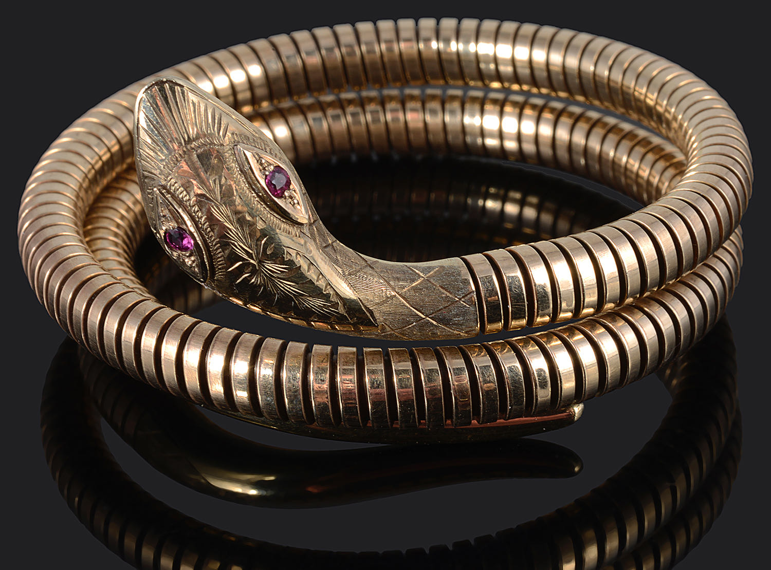 A Victorian style 9ct gold coiled sprung snake bracelet