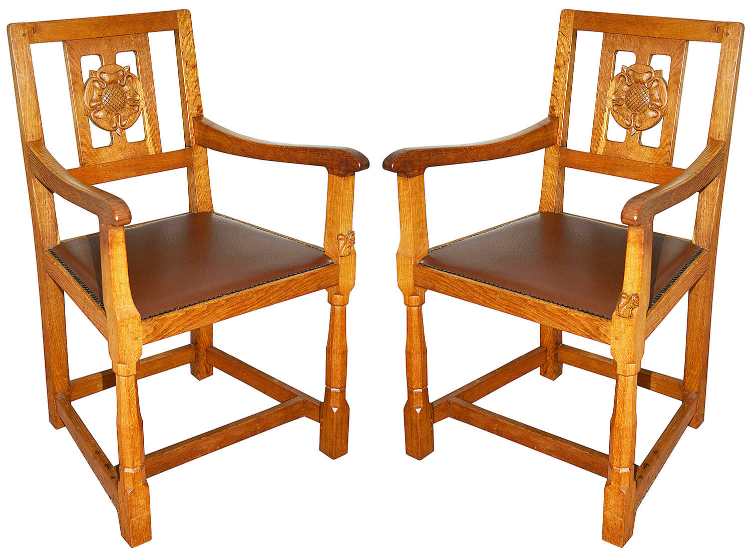 A pair of Wilf 'Squirrelman' Hutchinson oak elbow chairs