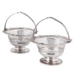 A pair of Edward VII silver swing handled bon bon baskets