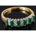 A contemporary emerald and diamond half eternity ring