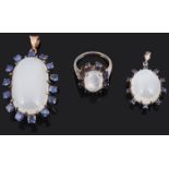 A large sapphire and moonstone pendant, another and a similar ring