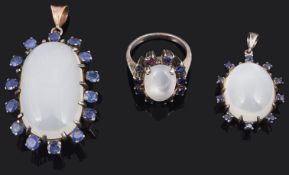 A large sapphire and moonstone pendant, another and a similar ring